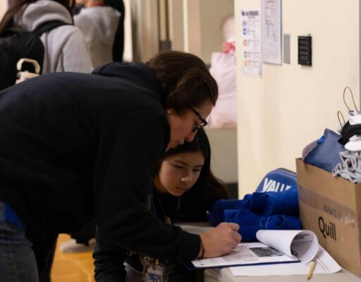 Athletic Director, K.T. and director for the day Avery M. prepping for the game