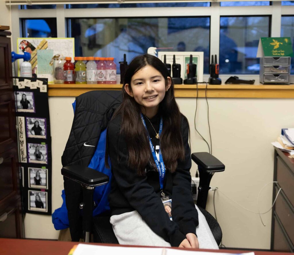 Avery M, at director's desk during director for a day evening