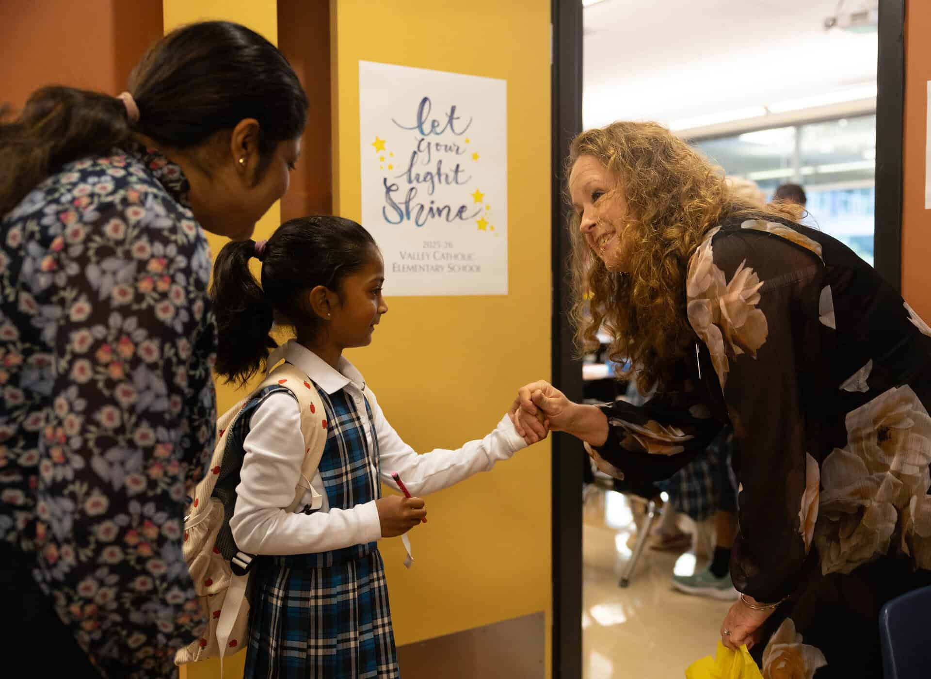 VCES teacher greets student