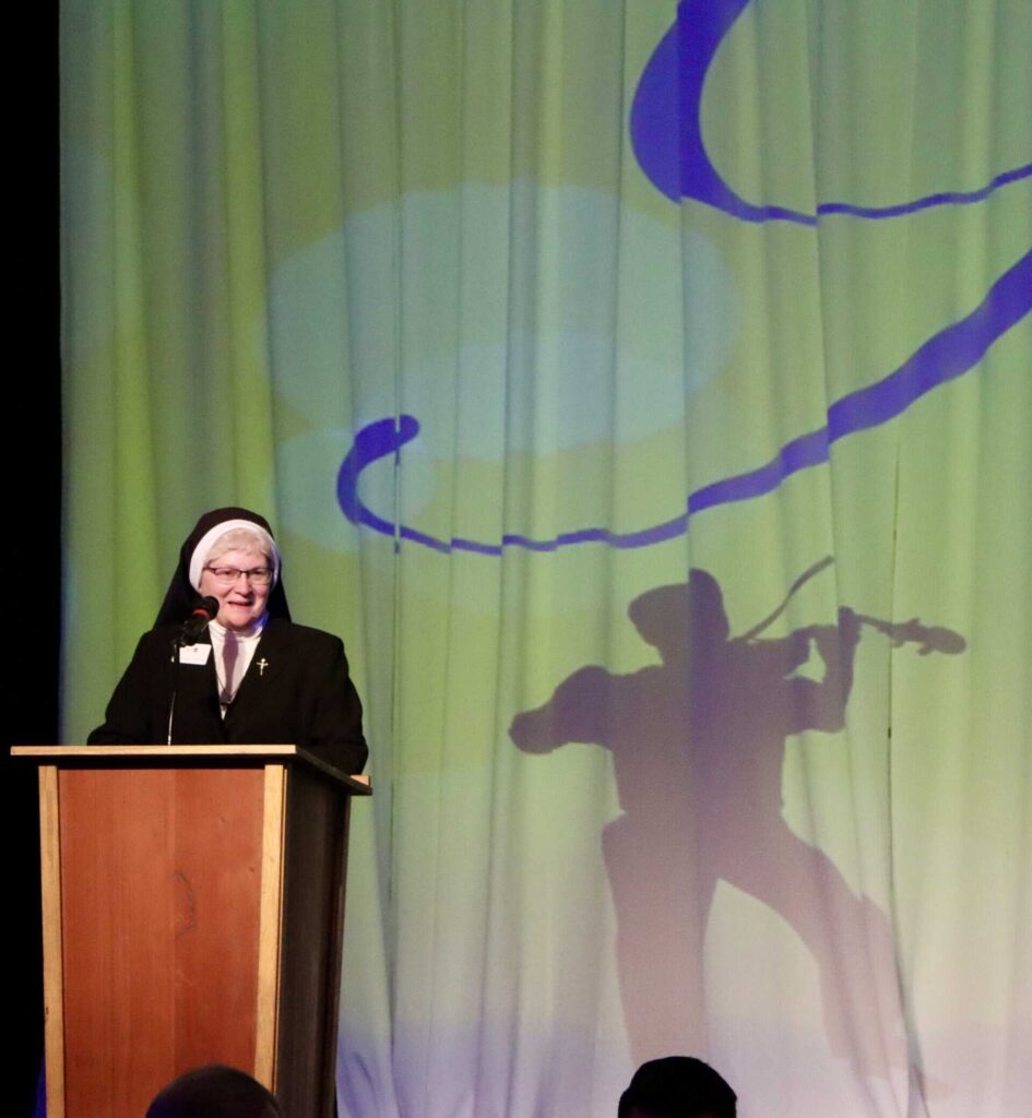 Sr. Michael Francine Duncan speaking at podium; Gala 2022