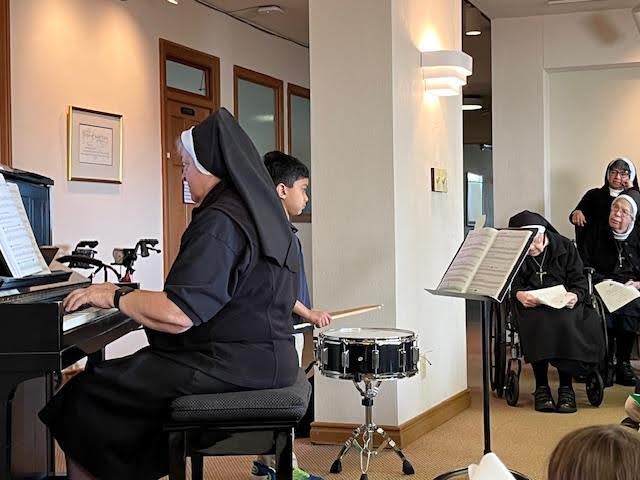 Sisters performing for ES students