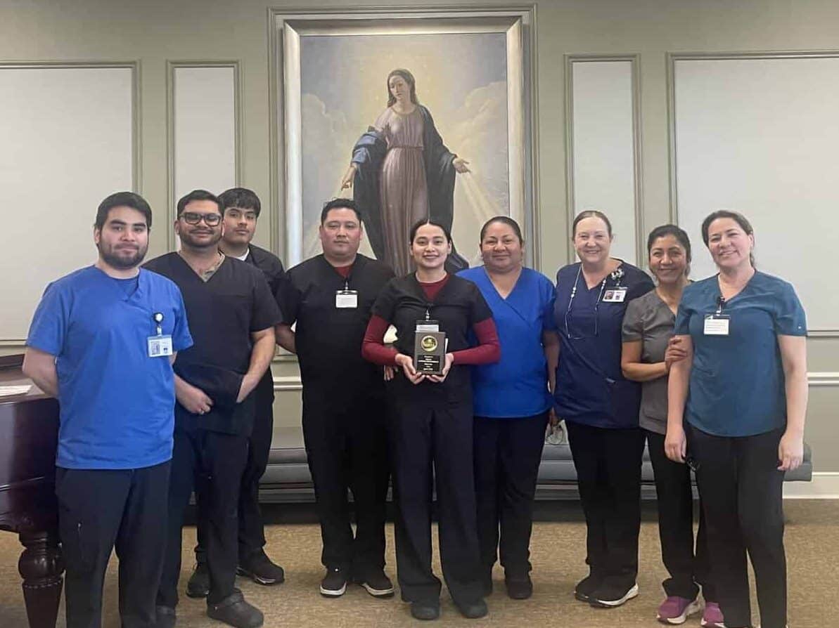 Dulce Santana Moterreso, Maryville's Employee of the Month for April with her team
