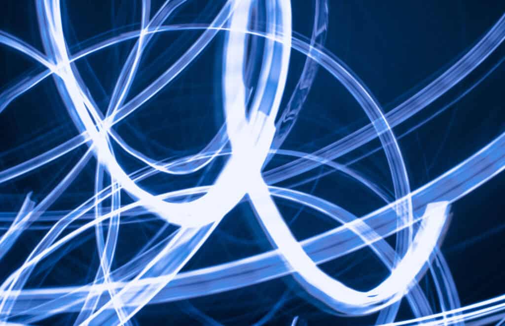 Gala poster competition shows swirls of white light on a dark blue backdrop