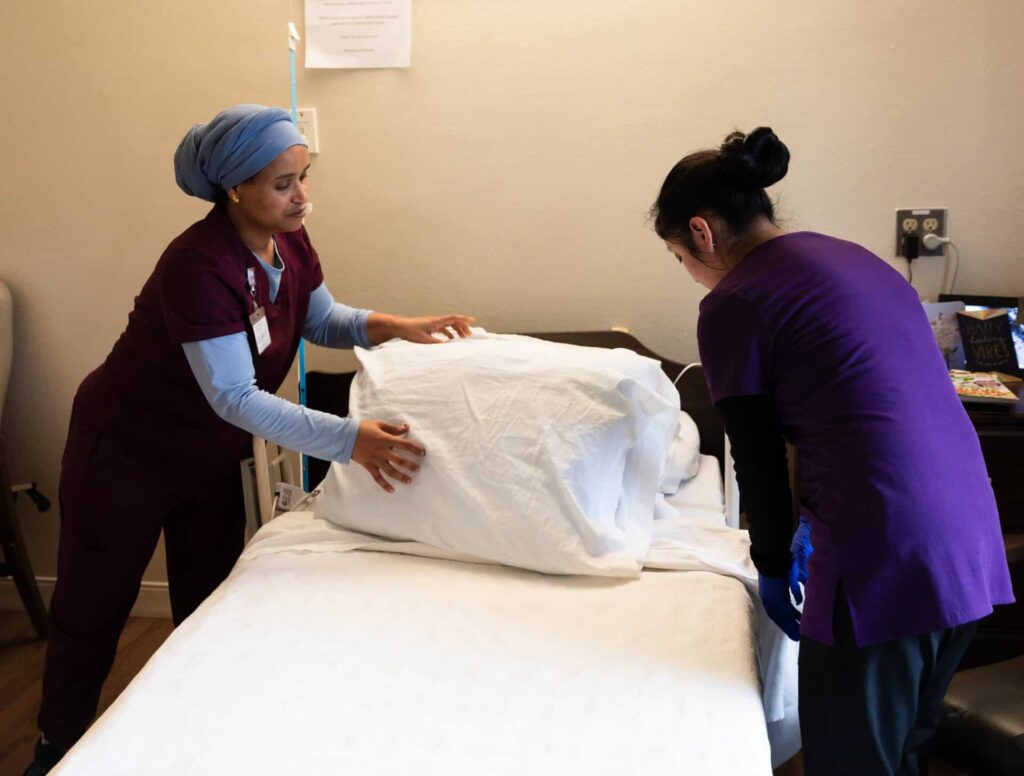 Maryville nurses prepping and setting up the bed