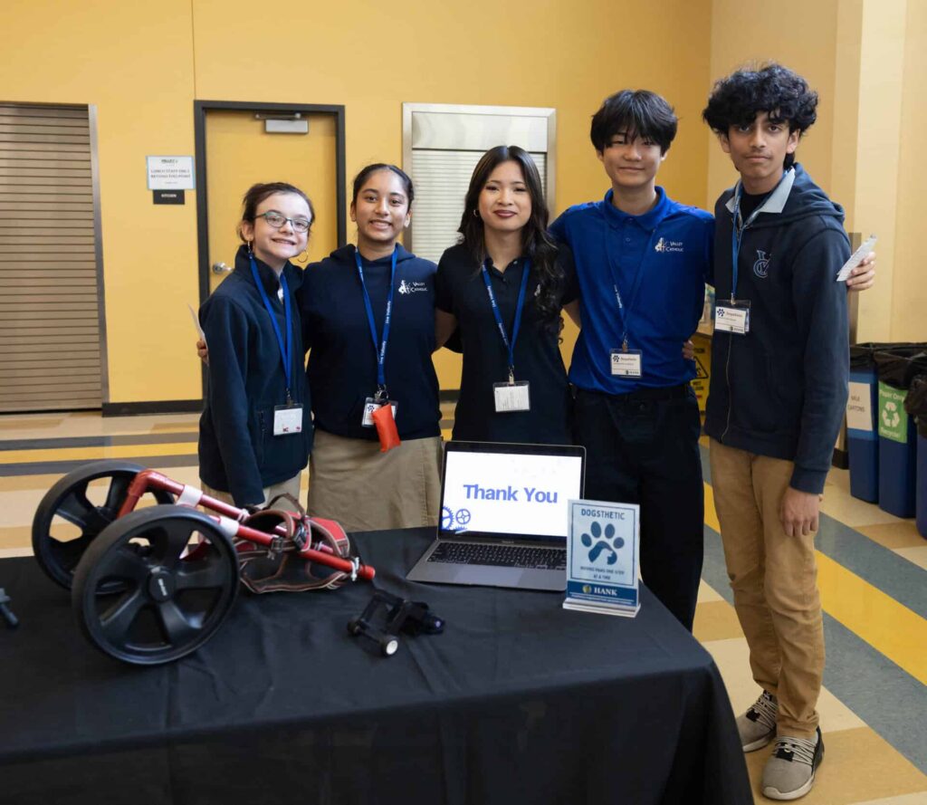 STEM students posing after their dog mobility presentation