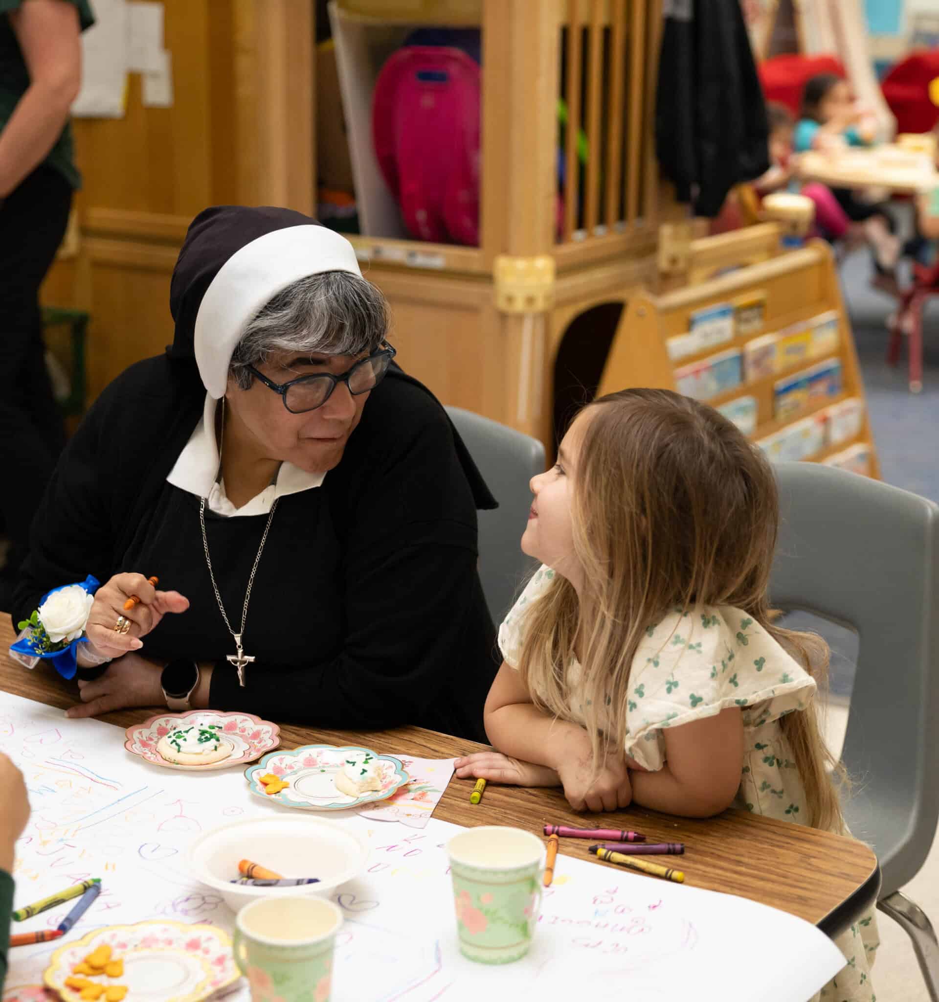 Sister Juana having tea with an Early Learning Student