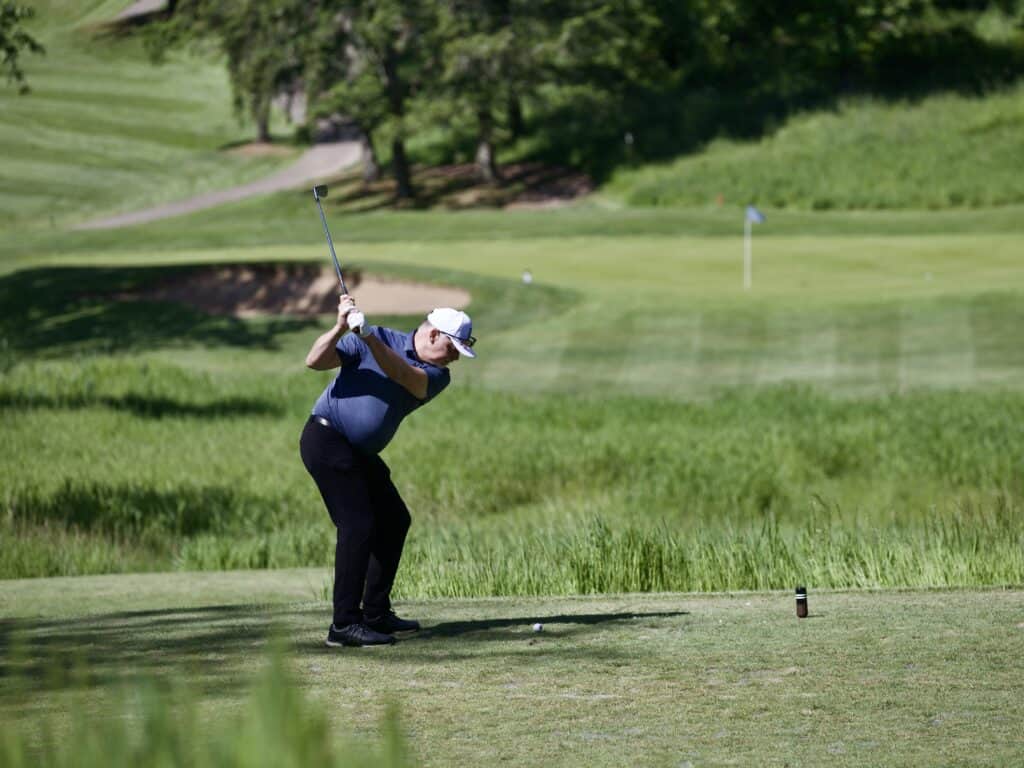 Golfer takes his drive