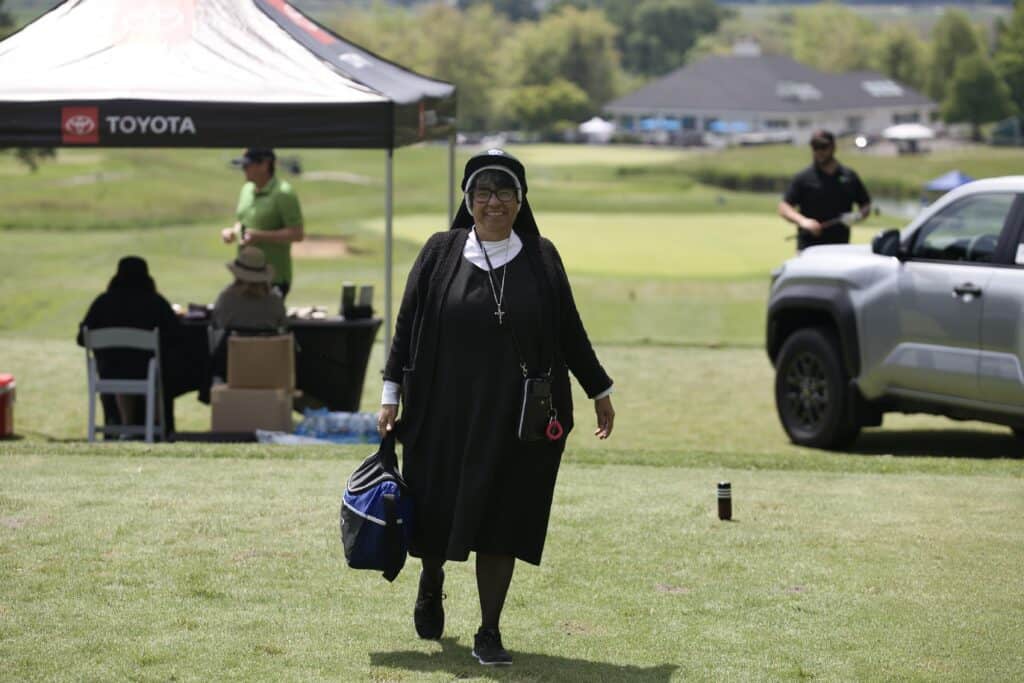 Sister helping on the golf course