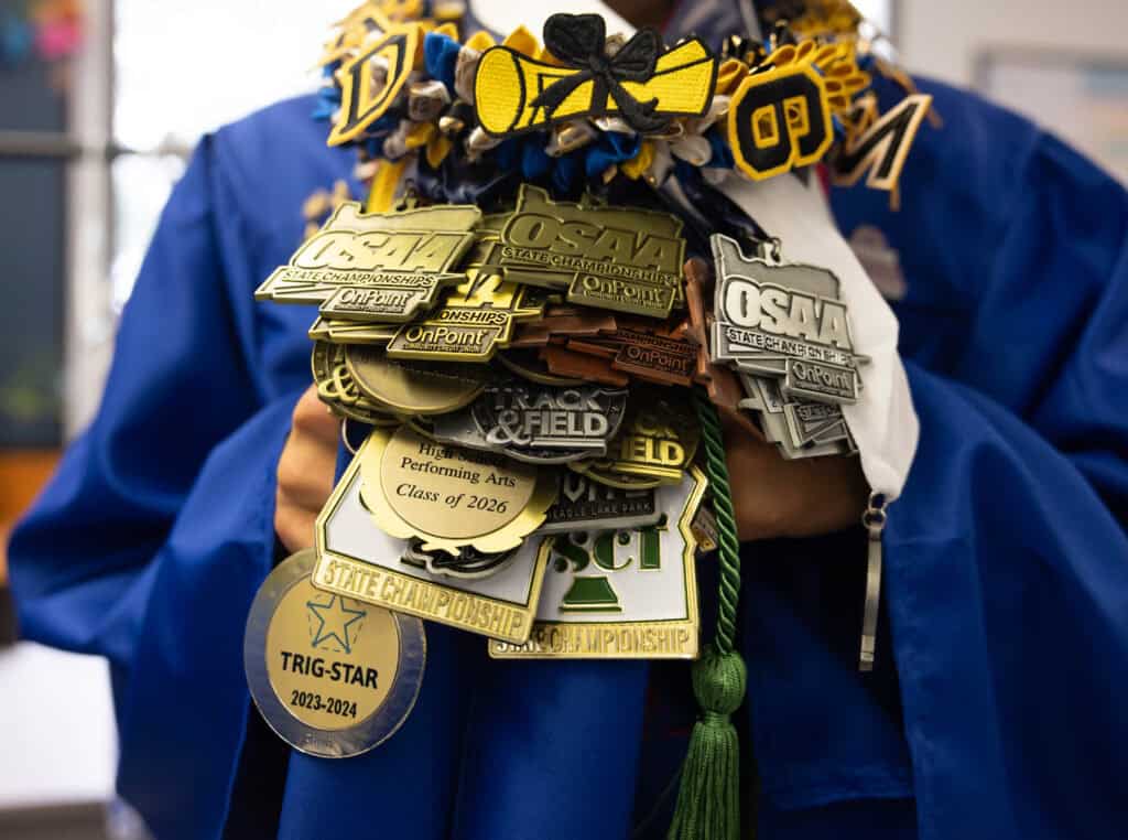 Graduate shows off awards