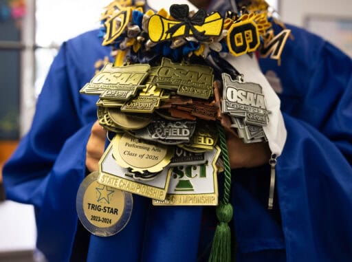 Graduate shows off awards