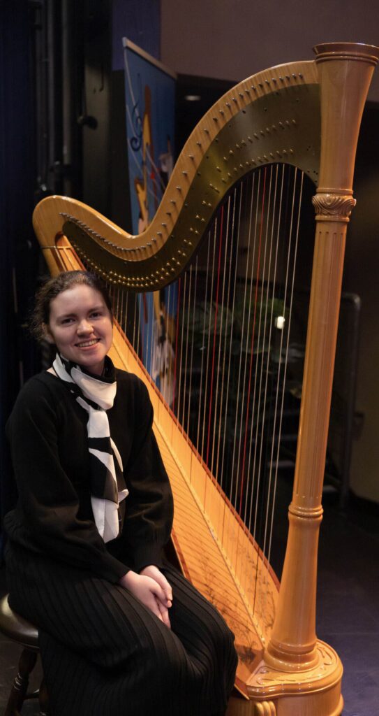 At the Young Artist Recitals, a student with the harp