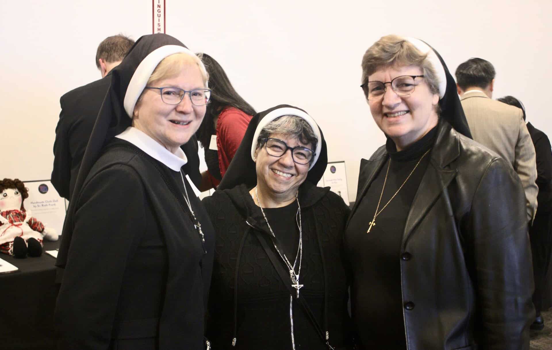 At 2025 Gala silent auction - Sister Michael Francine Duncan, left; Sister Juana Gutierrez Mares, middle; Sister Adele Marie Altenhofen, right